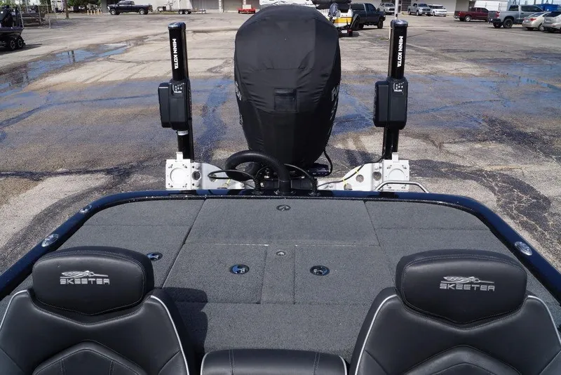 Slide: The Image of 2022 Skeeter ZX225 boat with covered motor and dual Minn Kota power poles. - 15
