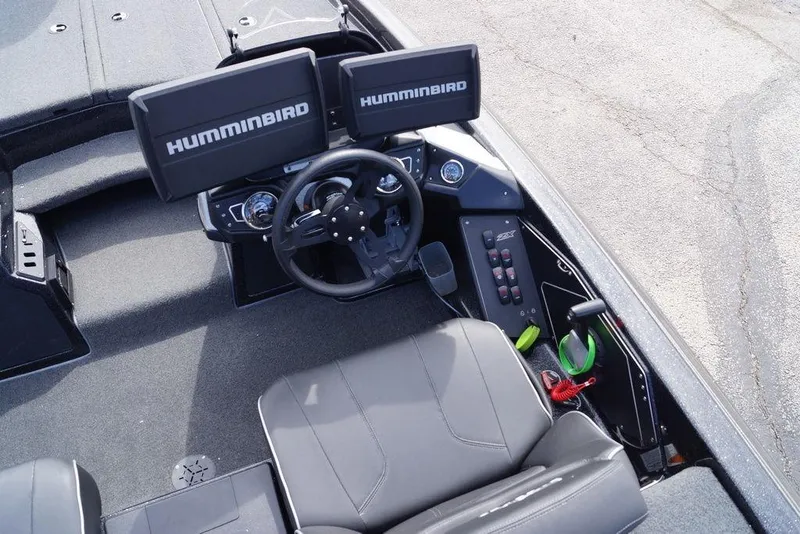 Slide: The Image of 2022 Skeeter ZX225 boat cockpit with dual Humminbird displays and steering wheel. - 18