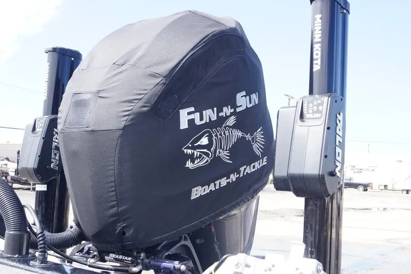Slide: The Image of 2022 Skeeter ZX225 boat engine with Fun-N-Sun Boats-N-Tackle cover and Minn Kota Talon anchors. - 2