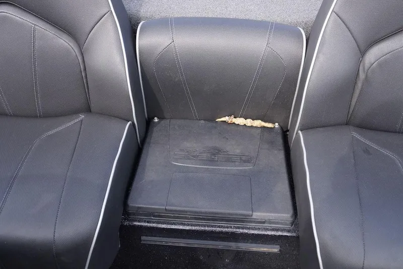 Slide: The Image of 2022 Skeeter ZX225 boat seats with a small debris on the center console. - 4