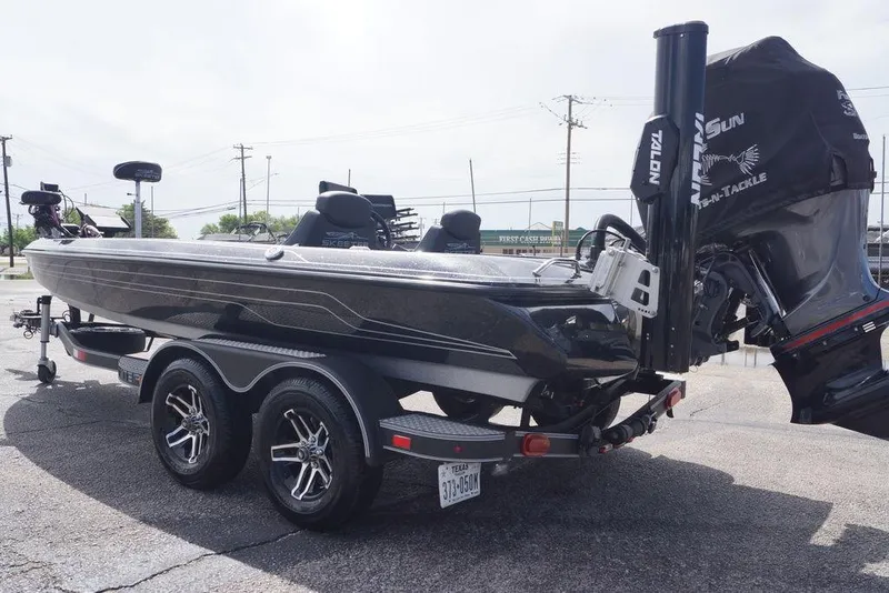 Slide: The Image of 2022 Skeeter ZX225 bass boat on trailer, featuring sleek design and powerful engine. - 6