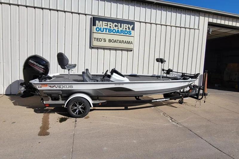 The Image of 2019 Vexus AVX1980 boat parked outside Ted's Boatarama, featuring Mercury outboard motor. - 0