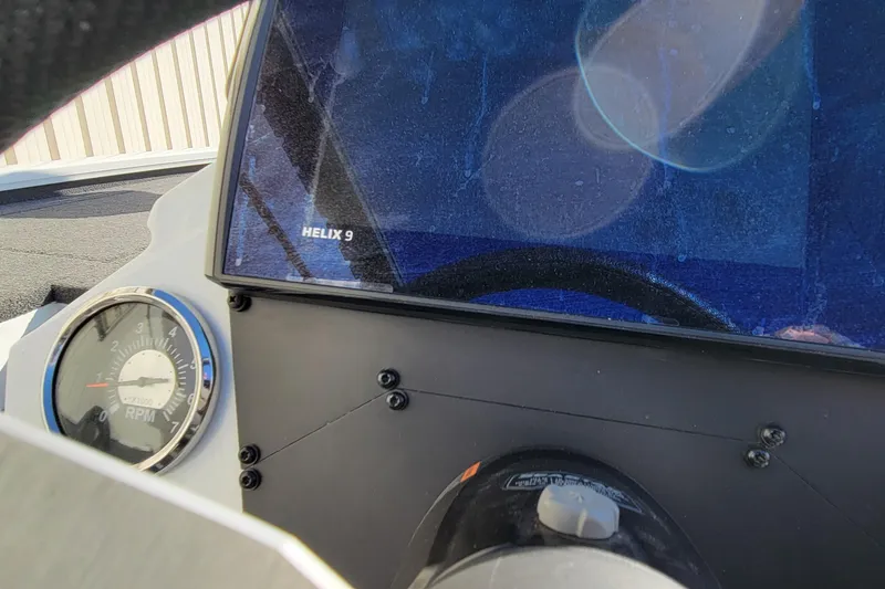 Slide: The Image of 2019 Vexus AVX1980 boat dashboard with steering wheel and Humminbird Helix 9 display. - 10