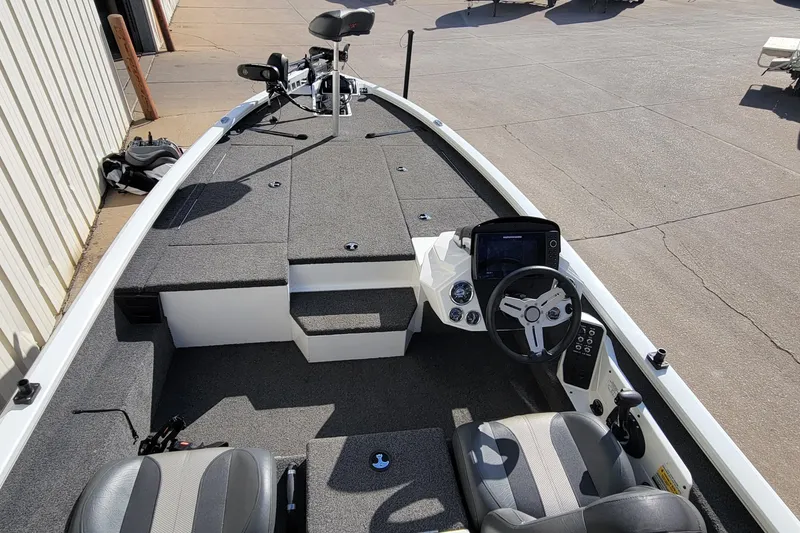 Slide: The Image of 2019 Vexus AVX1980 boat deck with trolling motor, parked outdoors. - 17