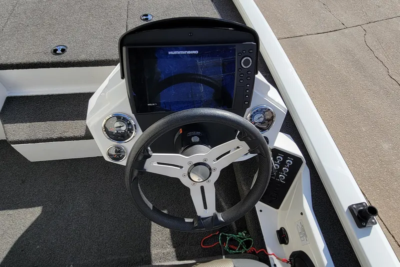 Slide: The Image of 2019 Vexus AVX1980 boat interior with steering wheel and seating. - 18