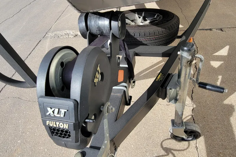 Slide: The Image of Trailer hitch of a 2019 Vexus AVX1980 boat on pavement. - 30