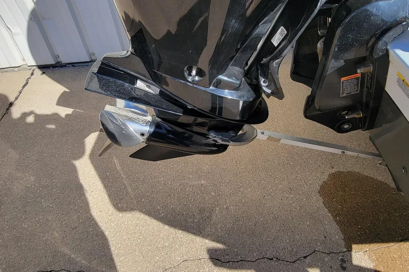 Slide: The Image of Mercury FourStroke engine on 2019 Vexus AVX1980 boat, parked outdoors. - 6