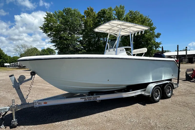 The Image of 2023 LFG 22 CC boat on trailer, parked outdoors under a clear sky. - 1