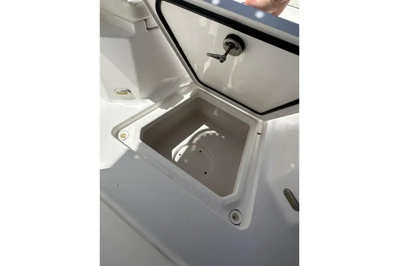 Slide: The Image of Open storage compartment on 2023 LFG 22 CC boat, showcasing interior space. - 15