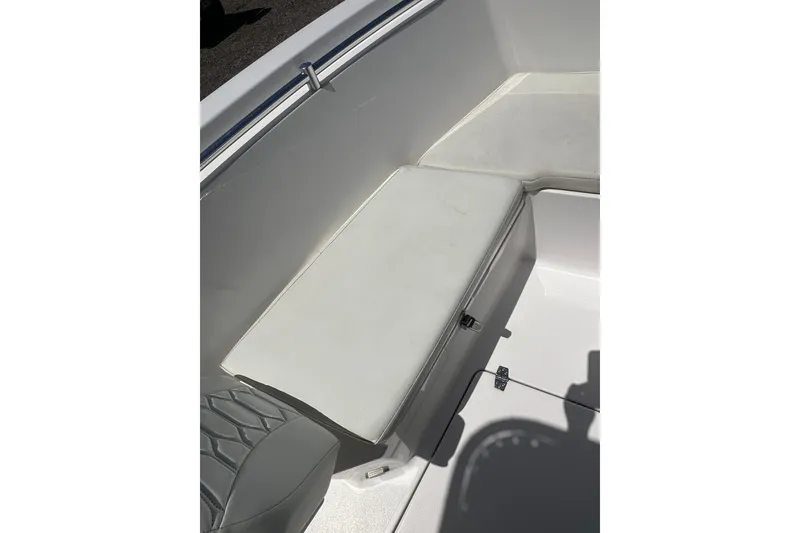 Slide: The Image of 2023 LFG 22 CC boat interior with white cushioned seating. - 16