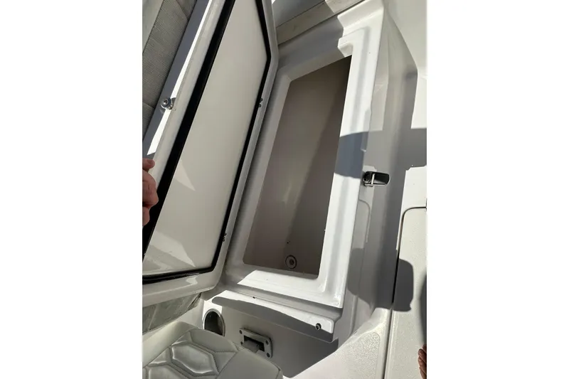 Slide: The Image of Open storage compartment on 2023 LFG 22 CC boat, showcasing interior space. - 17