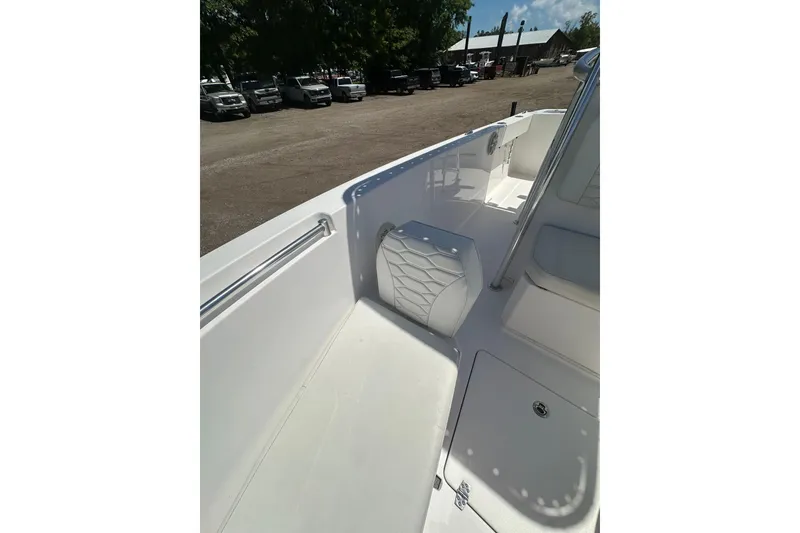 Slide: The Image of 2023 LFG 22 CC boat interior with white seating and storage compartments. - 20