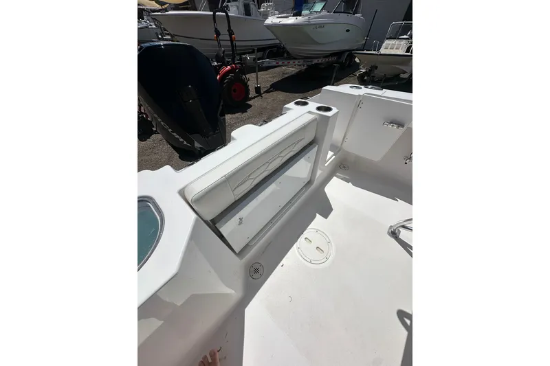 Slide: The Image of 2023 LFG 22 CC boat interior with seating and storage compartments. - 25