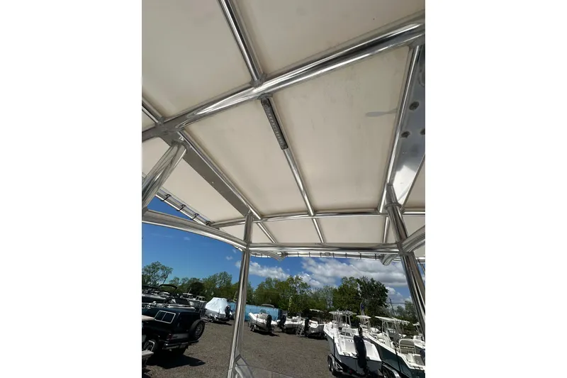 Slide: The Image of Rooftop view of 2023 LFG 22 CC boat with parked boats in background. - 28