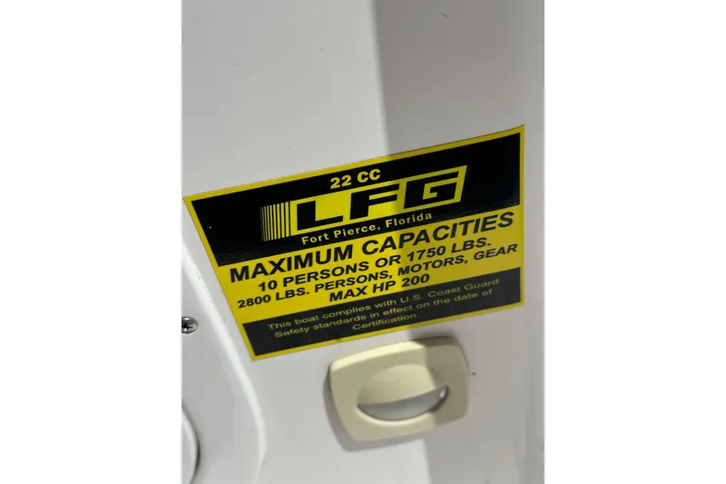 Slide: The Image of 2023 LFG 22 CC boat capacity label, Fort Pierce, Florida, maximum 10 persons or 1750 lbs. - 32