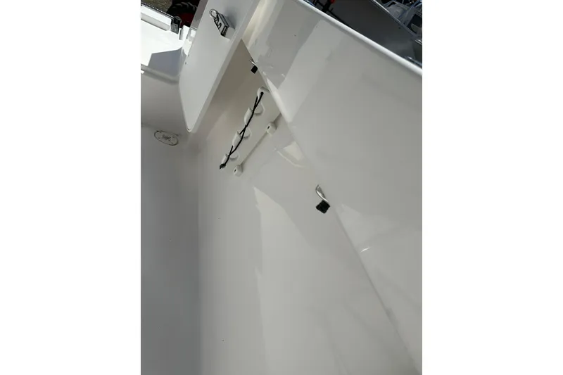 Slide: The Image of Interior view of 2023 LFG 22 CC boat, showcasing storage compartment and sleek design. - 33