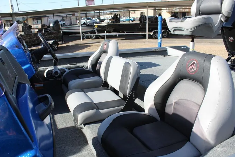 Slide: The Image of 2019 Alumacraft XB 200 boat interior with gray and black seating. - 14