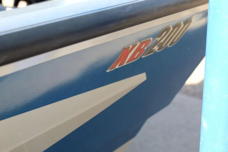 Slide: The Image of 2019 Alumacraft XB 200 boat side view with model name visible. - 8