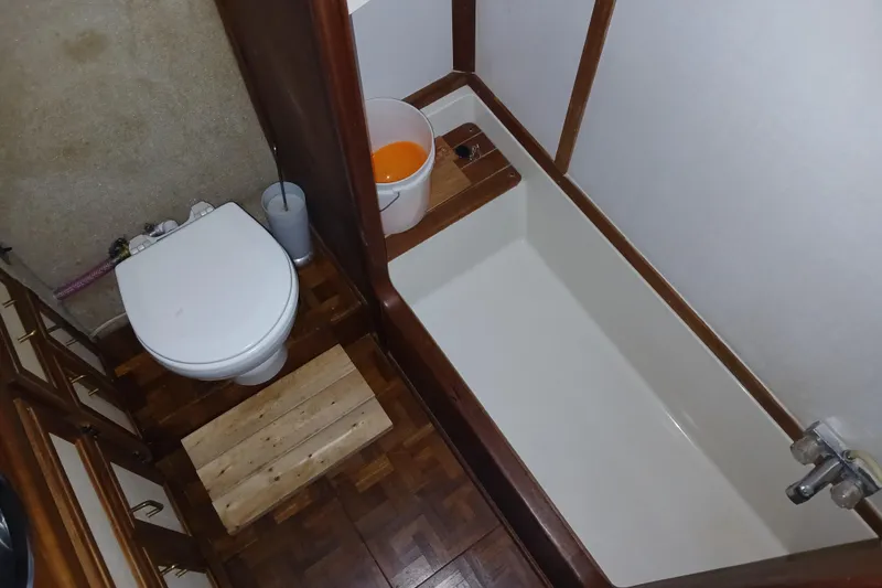 Slide: The Image of Bathroom interior of 1988 Carver 36 Command Bridge with toilet and bathtub. - 7
