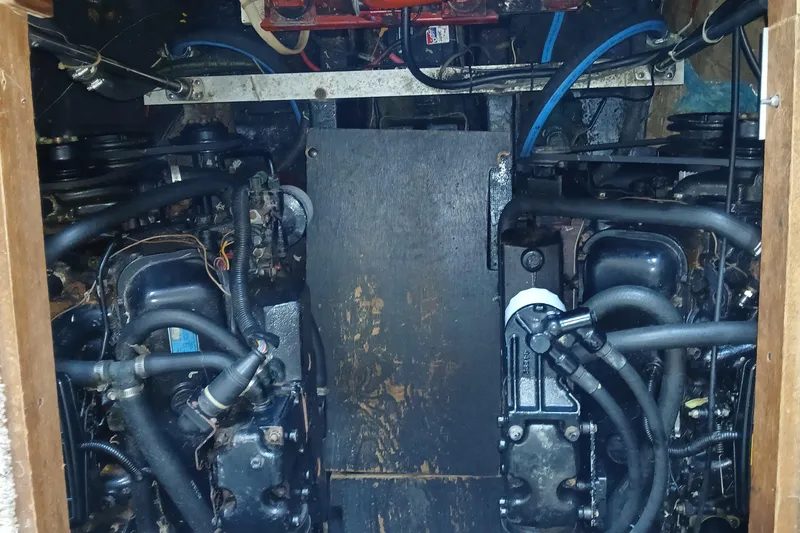 Slide: The Image of Engine compartment of a 1988 Carver 36 Command Bridge boat, showcasing dual engines. - 9