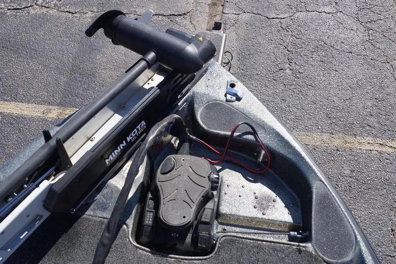 Slide: The Image of 2010 Bass Cat Cougar boat with Minn Kota trolling motor on asphalt. - 13