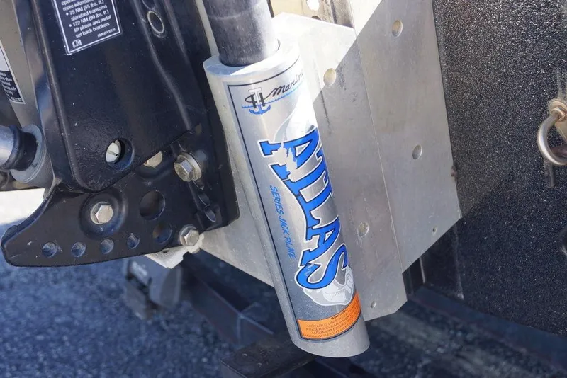 Slide: The Image of Atlas hydraulic jack plate on a 2010 Bass Cat Cougar boat. - 2