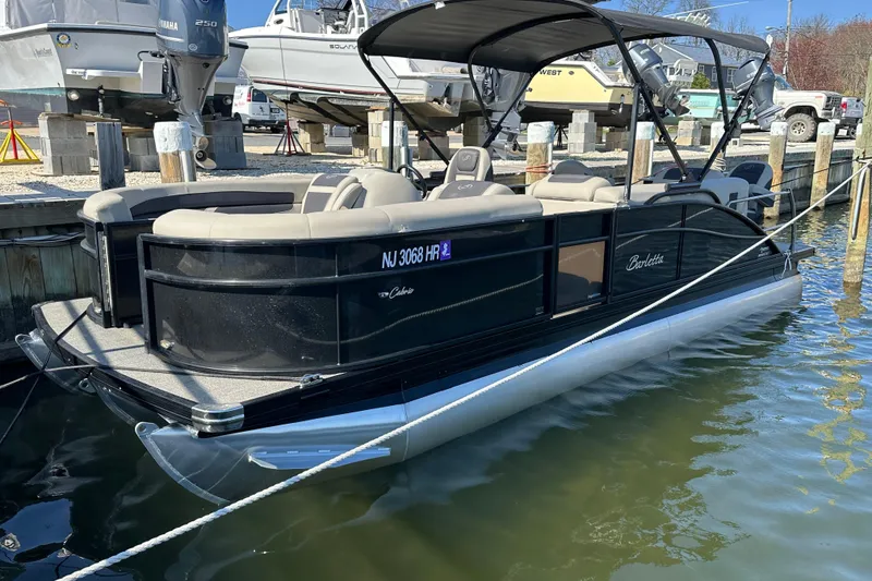 Slide: The Image of 2022 Barletta Cabrio 22CC pontoon boat docked in marina. - 11