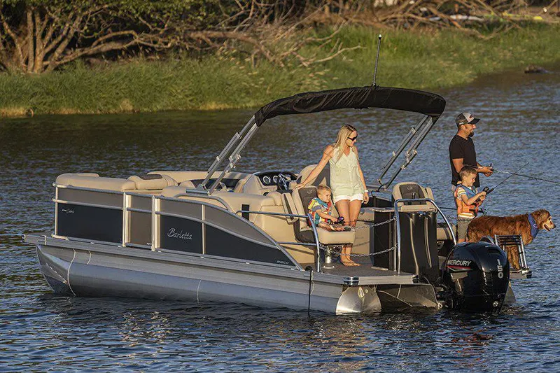 Slide: The Image of Manufacturer Provided Image: 2022 Barletta Cabrio 22CC pontoon boat with family and dog on a lake. - 18