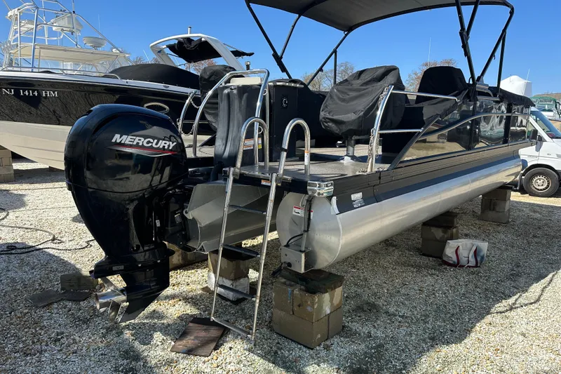 Slide: The Image of Barletta Cabrio 22CC 2022 pontoon boat with Mercury outboard engine on display. - 20