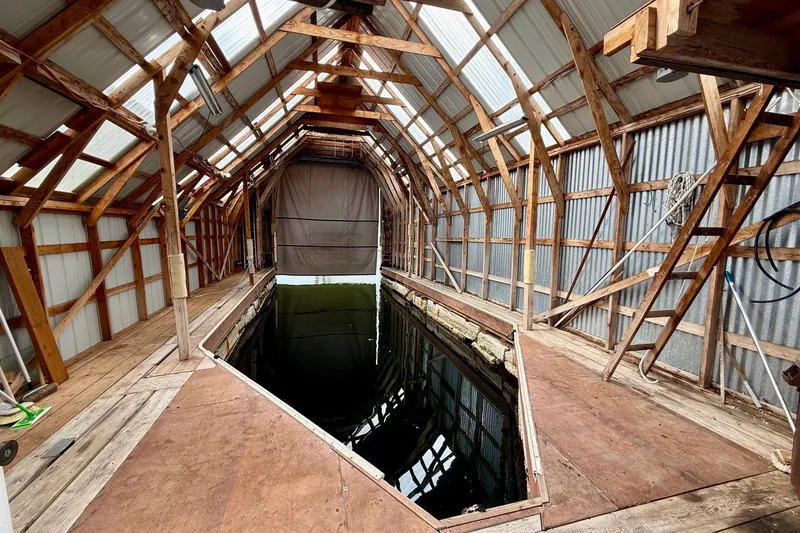 The Image of Wooden boathouse interior with water channel, BoatHouse model 19x43, built in 1990. - 0