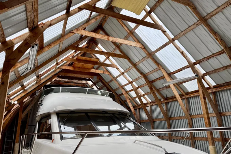 Slide: The Image of BoatHouse 19x43 model from 1990 stored in a wooden boathouse. - 2