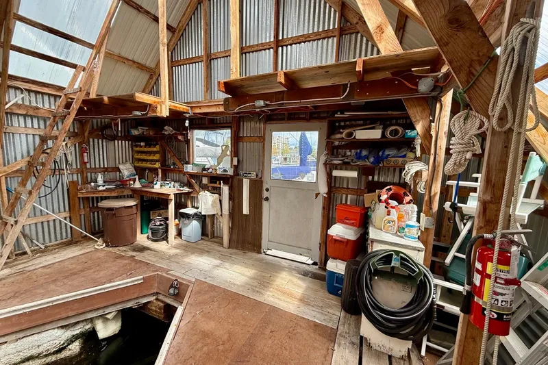 Slide: The Image of Interior of a rustic boathouse with tools and equipment, BoatHouse 19x43, 1990 model. - 8