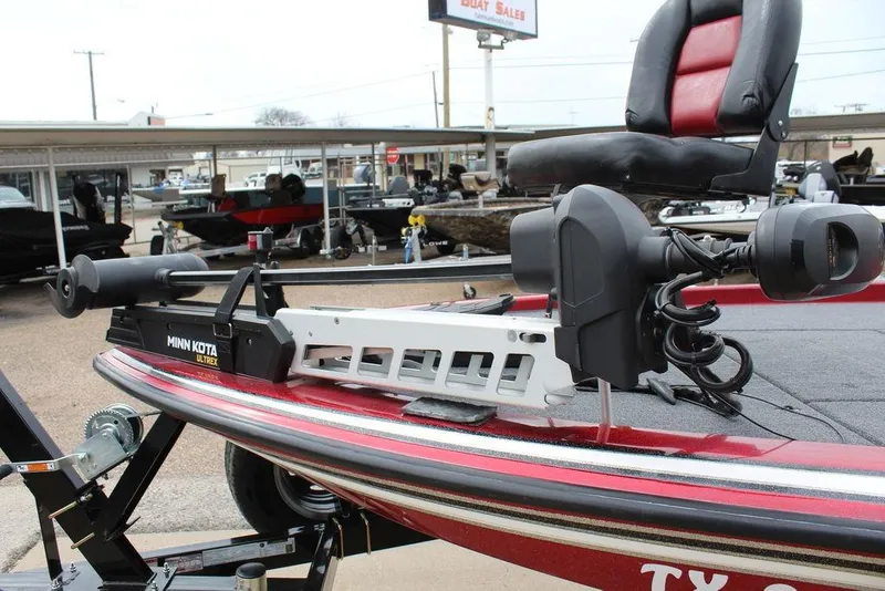 Slide: The Image of 2002 Skeeter ZX225 boat with Minn Kota Ultrex trolling motor and red seating. - 11