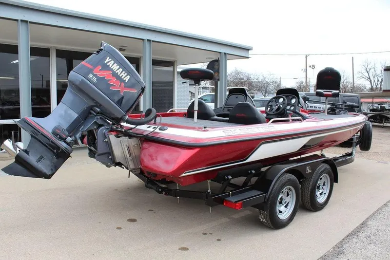 Slide: The Image of 2002 Skeeter ZX225 bass boat with Yamaha engine on trailer. - 4
