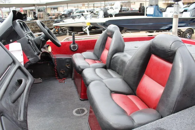 Slide: The Image of 2002 Skeeter ZX225 boat interior with black and red leather seats. - 5