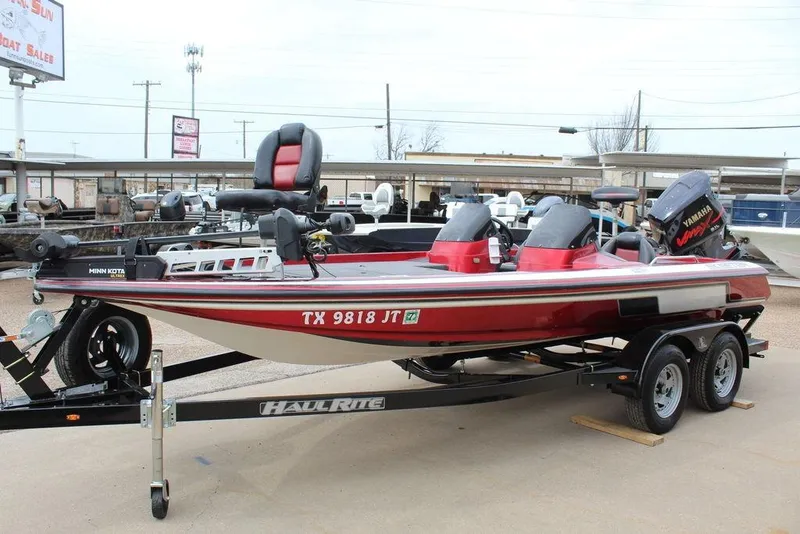 Slide: The Image of 2002 Skeeter ZX225 bass boat on trailer, featuring Yamaha outboard motor. - 8
