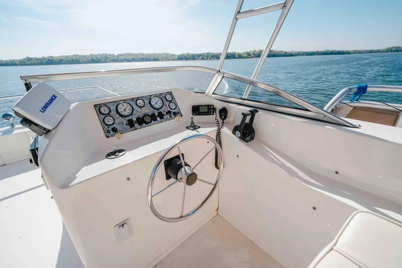 Slide: The Image of Steering console of 2009 Horizon 18x85 boat with gauges and navigation equipment. - 27