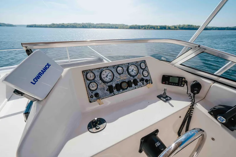 Slide: The Image of Control panel of a 2009 Horizon 18x85 boat with navigation equipment on a sunny day. - 28