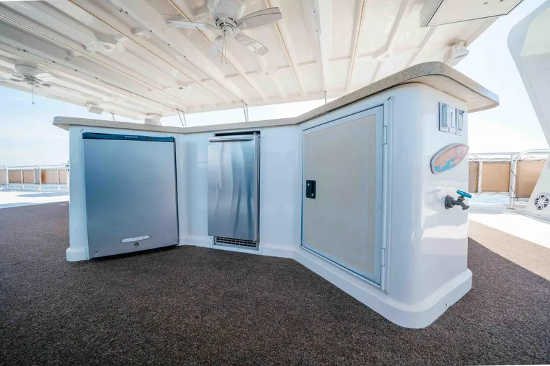 Slide: The Image of Luxurious outdoor bar area on a 2009 Horizon 18x85 yacht with modern appliances. - 31