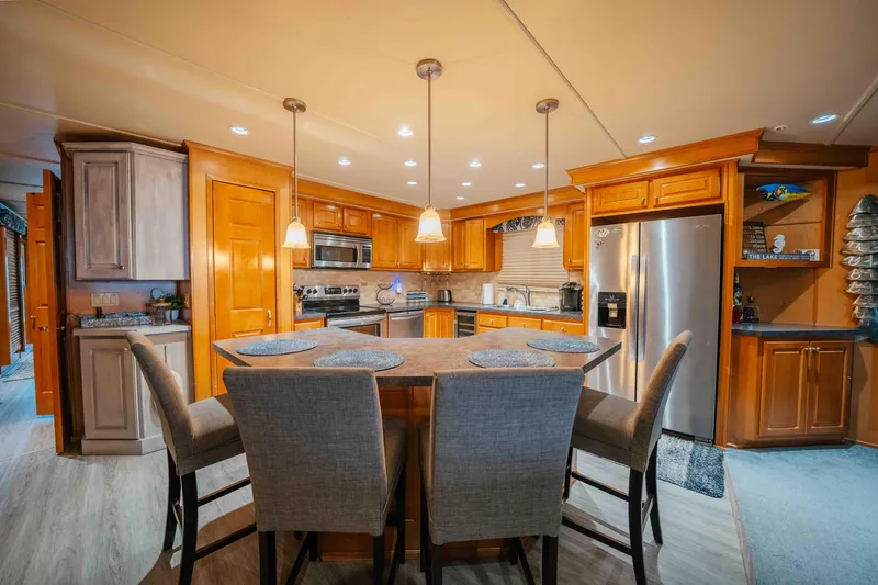 Slide: The Image of Luxurious kitchen interior in 2009 Horizon 18x85 houseboat with modern appliances and elegant lighting. - 36