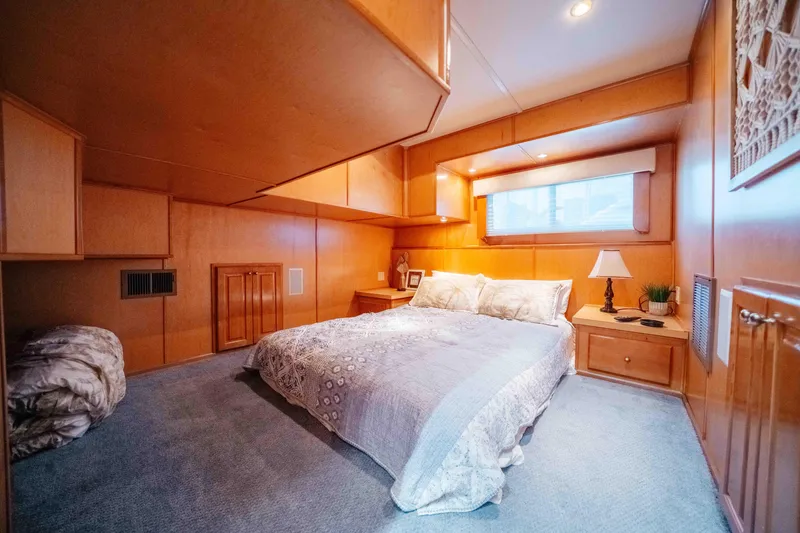 Slide: The Image of Cozy bedroom with wooden paneling in a 2009 Horizon 18x85 houseboat. - 49