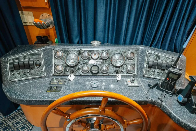 Slide: The Image of Control panel of a 2009 Horizon 18x85 boat with gauges and communication devices. - 51
