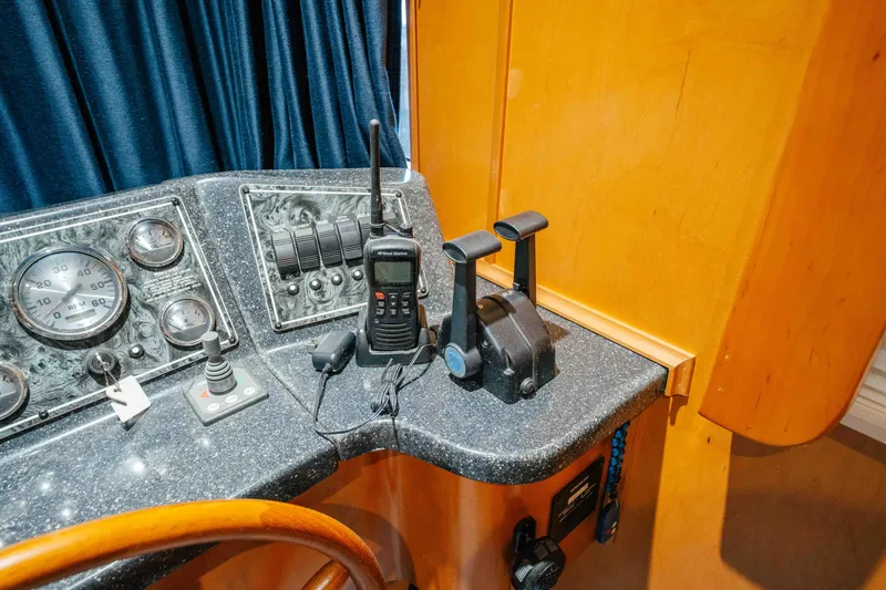 Slide: The Image of Control panel of a 2009 Horizon 18x85 boat with gauges and radio equipment. - 53