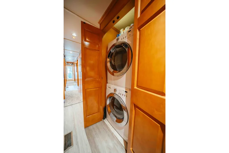 Slide: The Image of Stacked washer and dryer in wooden cabinet, Horizon 18x85, 2009 model. - 56