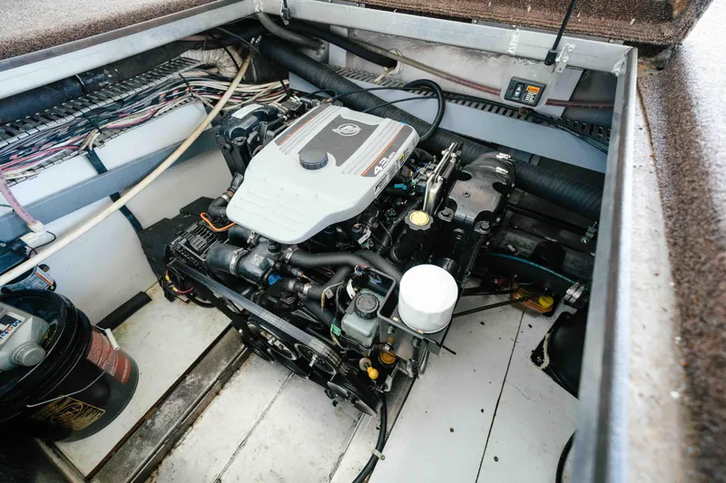 Slide: The Image of Engine compartment of a 2009 Horizon 18x85 boat, showcasing detailed wiring and components. - 57