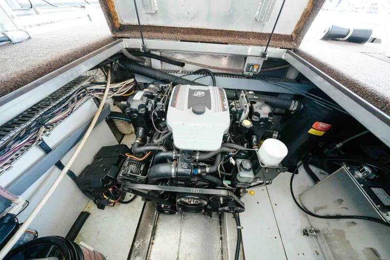 Slide: The Image of Engine compartment of a 2009 Horizon 18x85 boat, showcasing detailed wiring and components. - 58