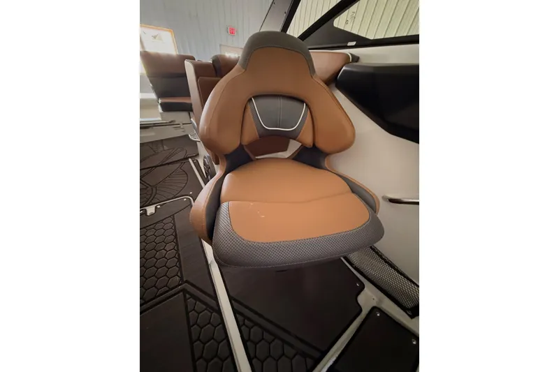 Slide: The Image of 2023 Scarab 255 ID boat seat with brown and gray upholstery. - 10