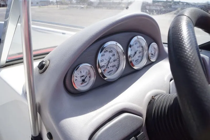 Slide: The Image of Dashboard of a 2002 Skeeter SL 210 boat with speedometer and RPM gauges. - 17