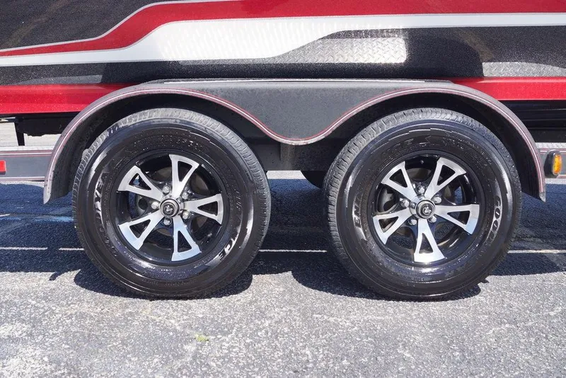 Slide: The Image of 2019 Skeeter ZX250 trailer with dual black alloy wheels and red accents. - 10