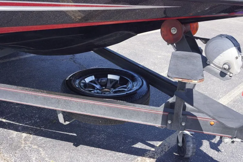 Slide: The Image of 2019 Skeeter ZX250 boat trailer with spare tire and winch. - 13